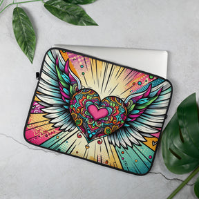 a laptop case with a heart and wings on it