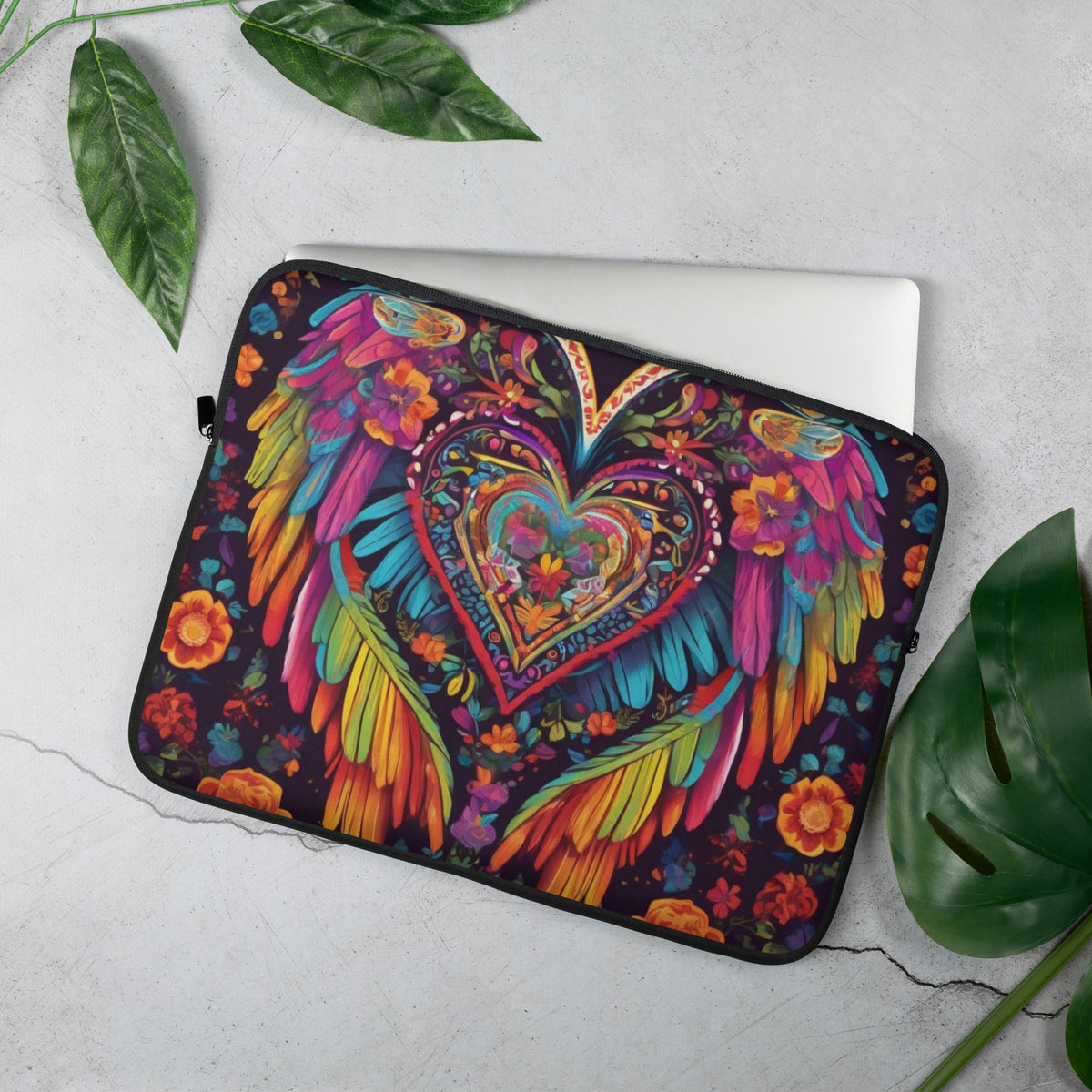 a laptop case with a colorful heart and wings on it